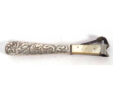 Vintage long handled cigar cutter, the scroll chased hollow handle stamped sterling with mother of pearl side supports, 15cm 