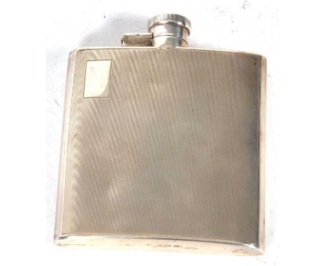 Art Deco silver hip flask of slight curved form, engine turned decoration and one side with a rectangular shaped vacant carto