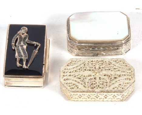 Three white metal boxes of filigree example, a rectangular shaped with a mother of pearl hinged lid example together with an 