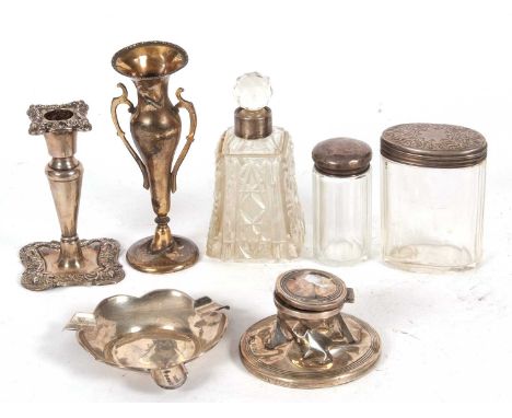 Mixed Lot: George V single embossed candle stick, Birmingham 1924, 12cm tall, a silver ashtray hallmarked for Birmingham 1919