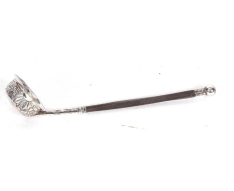 Early 19th Century Irish toddy ladle, the bowl sides embossed with floral and foliate designs and having a whalebone handle d