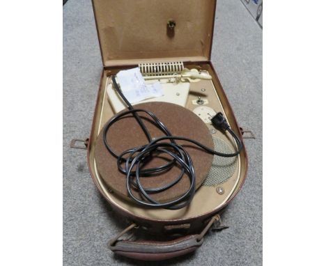 A vintage portable French 110A 127 volt record player in suitcase carrier 