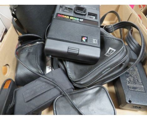 A tray of cameras and binoculars to include a Kodak EK160/EF instant camera 