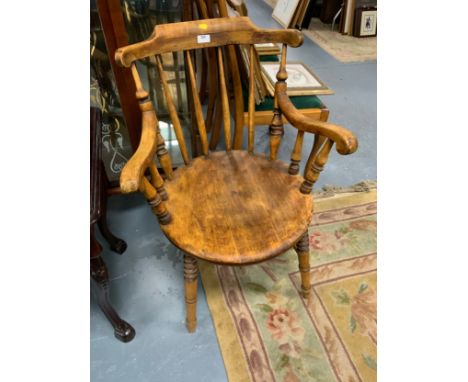 A vintage Windsor style armchair 