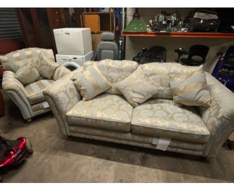 An Alston upholstered three seater sofa together with matching armchair and loose cushions 