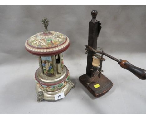 A vintage automated musical dispenser A/F together with a sewing implement 