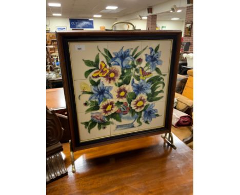 A floral tiled fire screen 