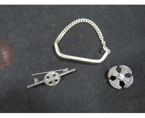 Two silver celtic style brooches and silver bracelets 