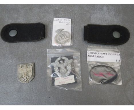 A SMALL COLLECTION OF WW2 GERMAN BADGES, to include Land Watch, Marine fund raising, signals arm patch and a pair of epaulett