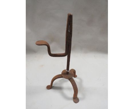 An iron tripod base rushlight holder 