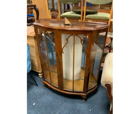 A vintage walnut china cabinet 