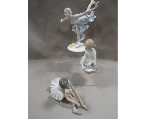 Two Nao figures together with a Valencia figurine of an ice skater 