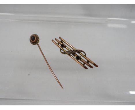 A 9ct amethyst and mother of pearl three bar brooch approx. weight 2.4g together with a 9ct amethyst and seed pearl stick pin