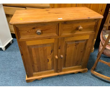 A small honey pine sideboard W 89 cm together with a pine wall shelf (2)