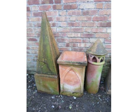 A selection of terracotta large garden ornaments to include pedestal obelisk and chimney pot (4) 