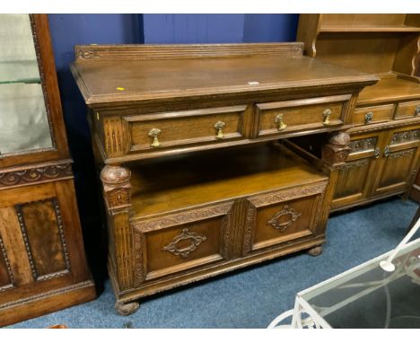 A heavy oak vintage serving buffet with carved detail W 122 cm 
