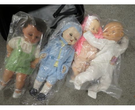A small case of vintage dolls 