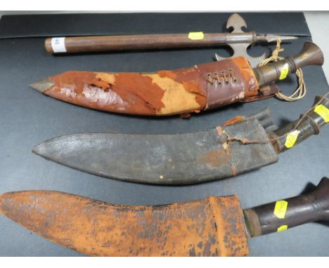 Three Gurkha knives and a decorative axe 