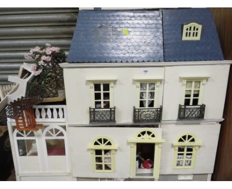 A vintage dolls house and contents A/F 