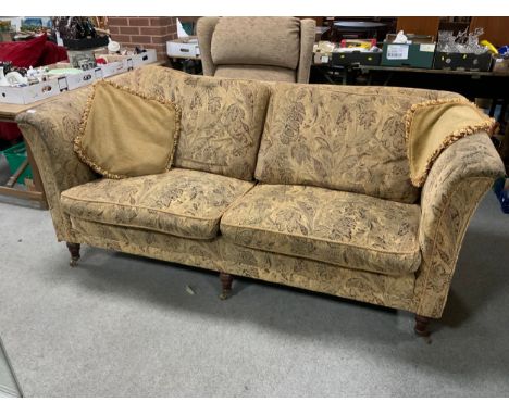 A three seater tapestry upholstered sofa 