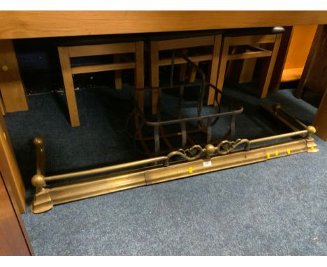 A vintage brass fire fender