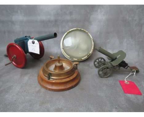 TWO VINTAGE MODEL TOY CANNONS, a trench art ashtray and military light fitting with etched glass lens