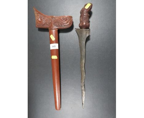 An early 20th century Javanese Kris dagger, with finely carved hardwood grip and scabbard