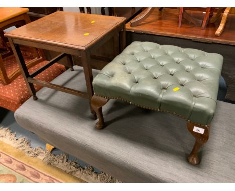 A vintage green upholstered footstool together with oak occasional table. (2) 