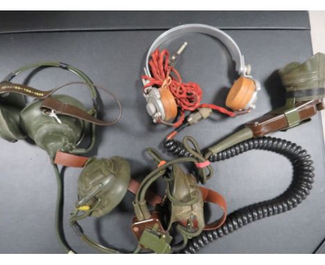 Two pairs of WW11 radio headphones marked 5965-99-100, the first dated 1939, the second 1940, the later also fitted microphon