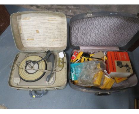 A vintage portable record player, a quantity of super 8 film, dolls etc