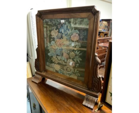 A Victorian walnut framed tapestry fire screen 