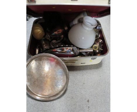 A vintage suitcase containing metalware 