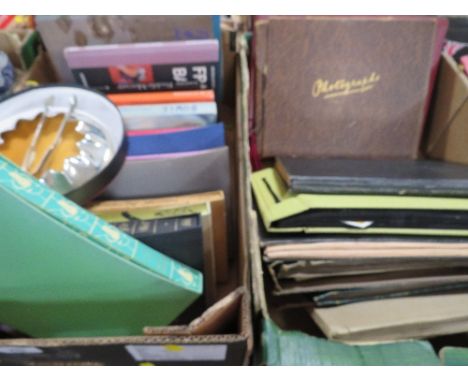 A tray of books to include folio society examples together with a tray of vintage photograph and postcard albums to include m