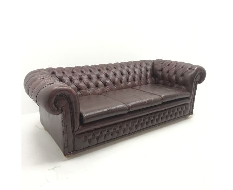 Three seat chesterfield sofa upholstered in a deep buttoned maroon leather, W205cm - Condition Report 