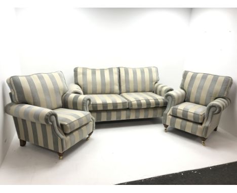 Alstons two seat Amberley sofa upholstered in grey and pale gold stripes, turned supports on castors (W195cm) and two matchin