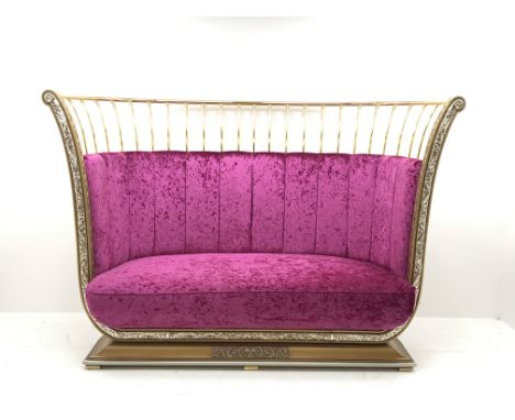Cappelletti Cantu Italian gilt metal framed curved sofa, upholstered in crushed pink velvet, on gilt stepped base, W217cm, D9