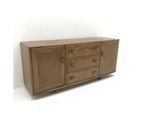 Ercol light elm sideboard, two cupboards flanking three drawers, W156cm, H69cm, D45cm - Condition Report 