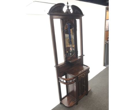 Victorian style mahogany hallstand, swan neck pediment with central finial above bevel edged mirror back , single drawer, two
