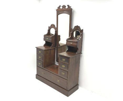Edwardian walnut drop centre dressing chest with central cheval mirror, nine graduating drawers, platform base, W115cm, H196c