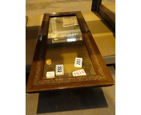 Oak framed antique mirror with carved surround