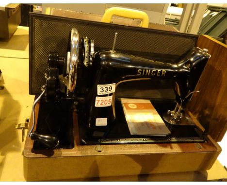 Vintage singer hand operated sewing machine in case with iinstruction book