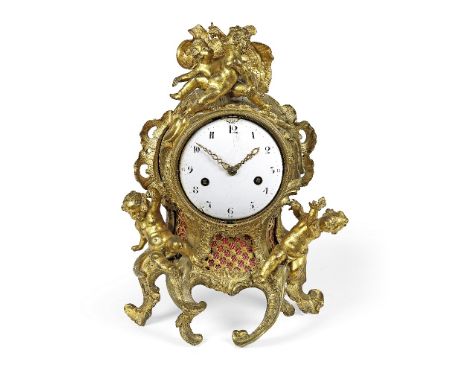 An impressive mid 18th century French ormolu mantel clock (the dial replaced)The rococo case mounted with four playful cherub