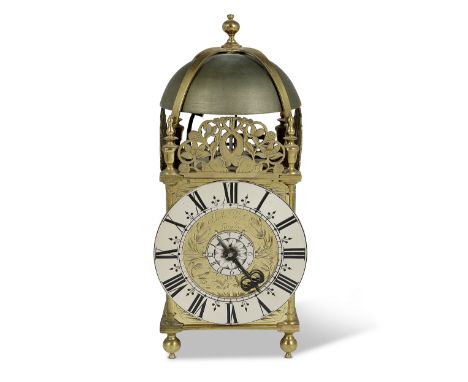 An 18th century brass lantern clockJohn Wise, LondonSurmounted by a strapped bell held within acorn type finials between thre