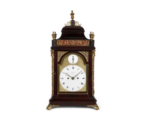 A late 18th century mahogany table clock with enamel dialsBrockbanks, LondonThe raised bell top case with urn finials on reed