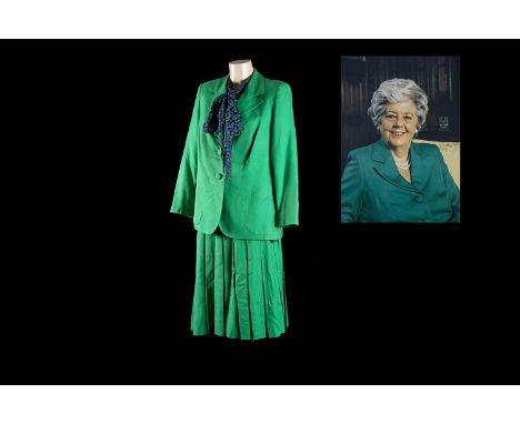 A Lachasse London green linen and silk business suit with Lachasse blouse, with accompanying photograph, taken by Derek Tamea