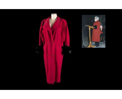A House of Fraser long red overcoat, with accompanying photograph of her ladyship at the House of Commons Carol Service 1996.