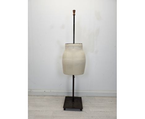 An adjustable mannequin on metal base. H.157 W.26 D.20cm. 