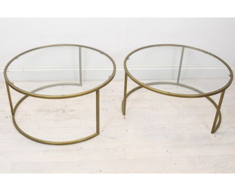 A pair of contemporary brass and glass coffee or lamp tables. H.36 W.70cm. 