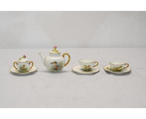A Royal Worcester hand painted two person complete dolls tea set, painted by D. Jones. Each piece painted with a different Br