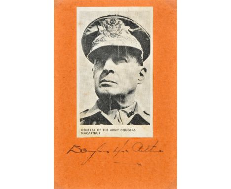 *MacArthur (Douglas, 1880-1964). Autograph signature in blue ink on a small light red autograph album page with black and whi